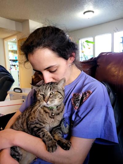 Melmeow the cat being reunited with her person