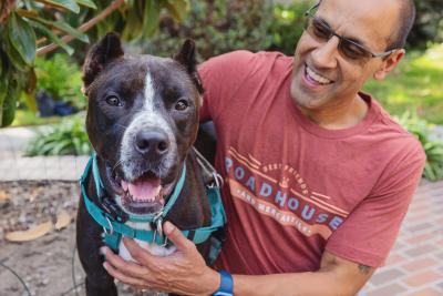 Volunteer Robert Lobo with Draco the dog