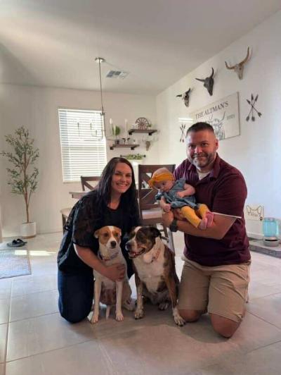 Rosie the dog with her new family in her home