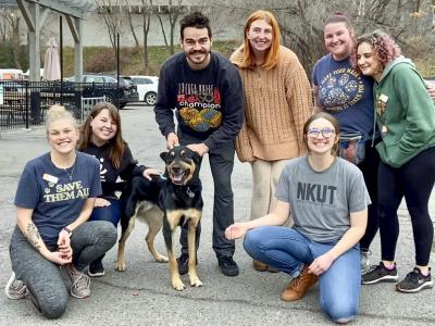Heath the dog with a group of seven people