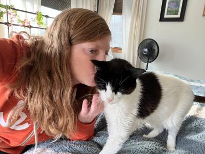 Allison kissing Stickers the cat