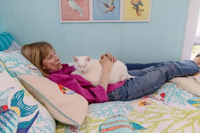 Person in bed with a cat