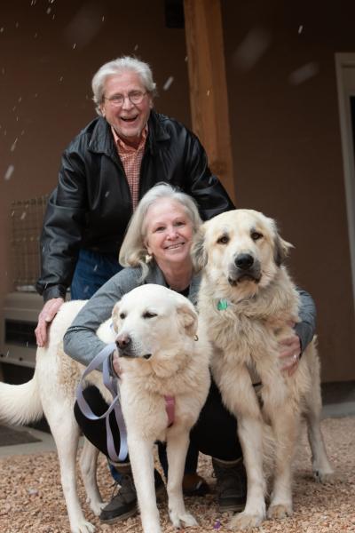 Val and Ty Hardin posing with Anna and Racer the dogs who they adopted