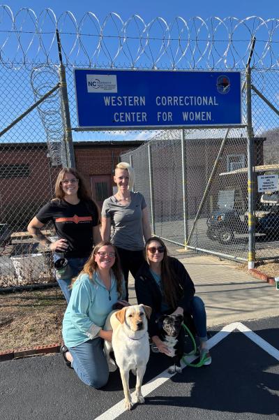 Group of people with a dog at the Western Correctional Center for Women