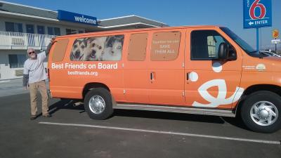 Volunteer Rich Yates beside a Best Friends transport van