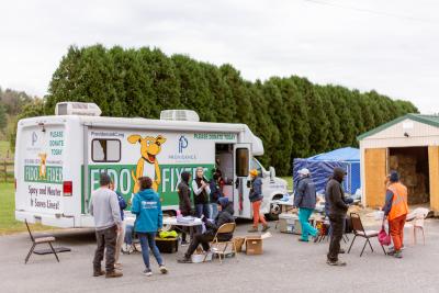 Fido Fixer animal welfare van with a lot of people outside of it following Hurricane Helene
