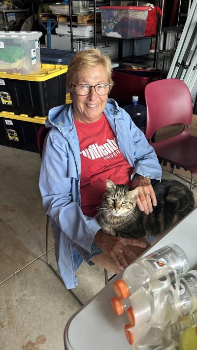 Person from Animal Protective League with a cat in her lap