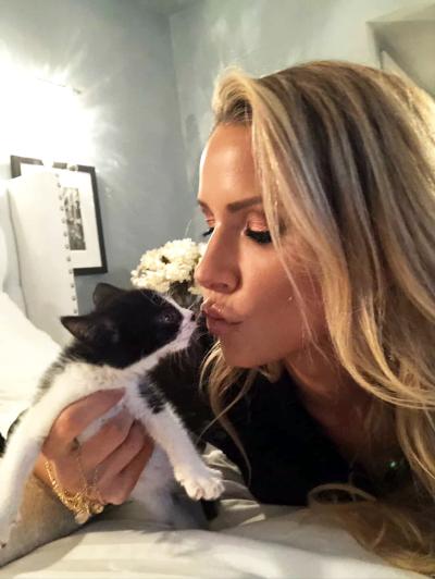 Frankie Giblin kissing a foster kitten
