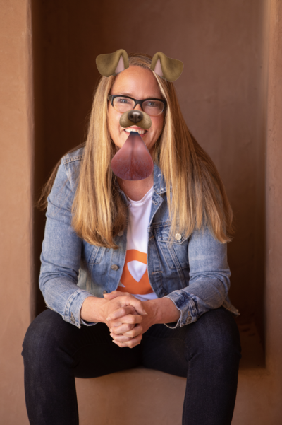 Best Friends CEO Julie Castle photo with a filter giving her dog ears, nose, and tongue