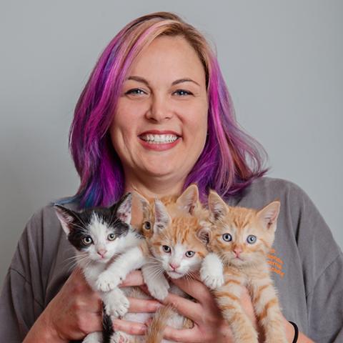 Courtney holding four kittens
