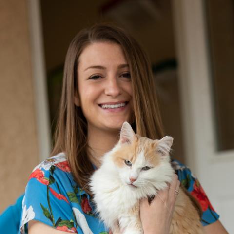 Elise Traub holding white and orange cat