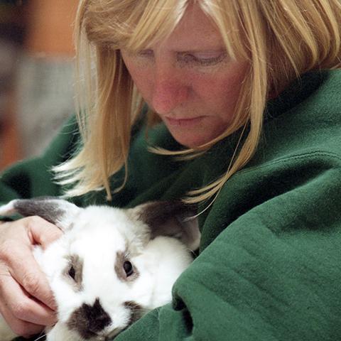 Chandra Forsythe holding a rabbit