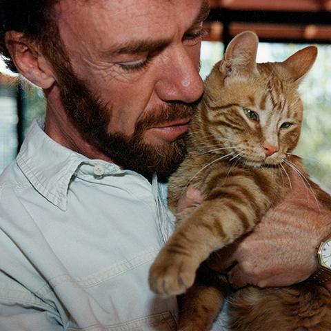 Michael Mountain holding an orange cat