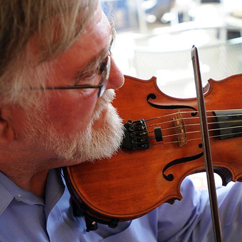 Virgil Barstad playing a violin