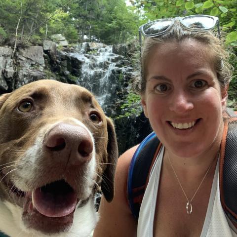 Shani on a hike with her dog, Jake