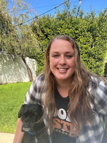 Tracy Hahn with a black dog