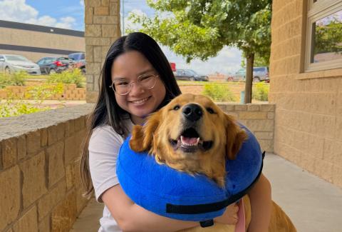 Christine Morey hugging a dog