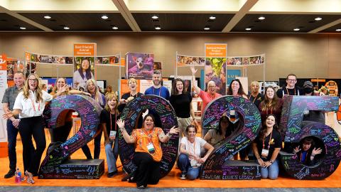 Group of people around a large 2025 number