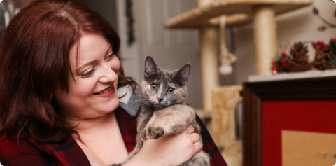 woman holding a cat