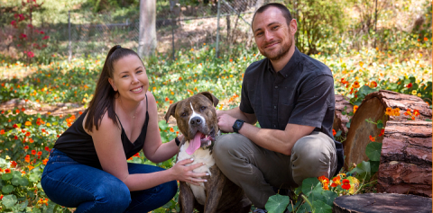 woman and man with a dog