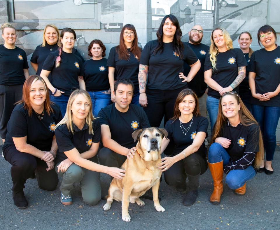 Group shot of first graduates from the SUU Executive Leadership Certification with a dog