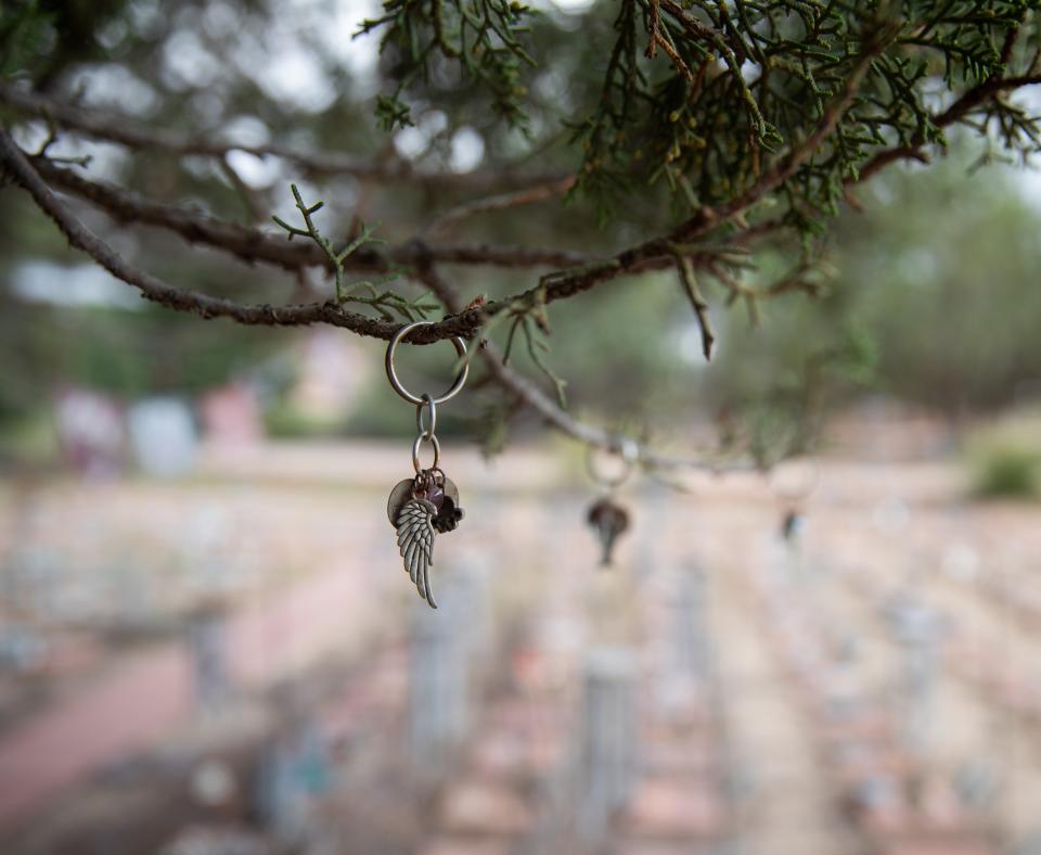 Memorial charms hanging from tree