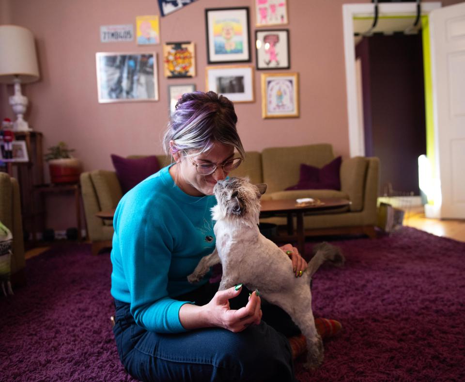 Sylvia the cat and Melissa, her foster person, nose-to-nose