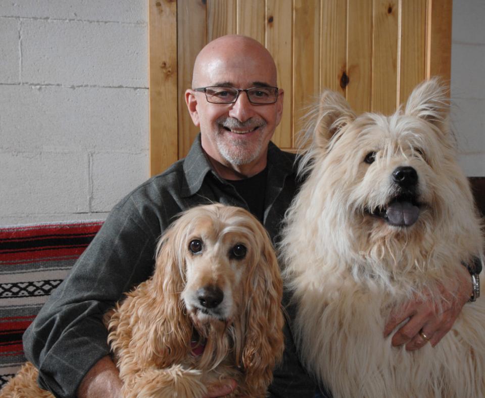 Best Friends co-founder Francis Battista with two of his dogs