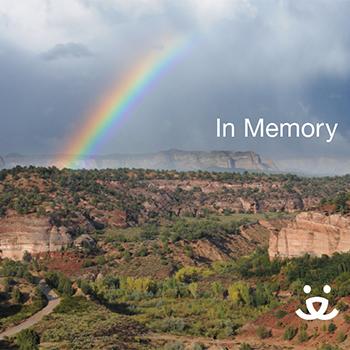 Photo of a rainbow over Angel Canyon with the words 'In memory' and the Best Friends logo