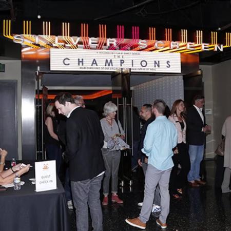 People at theater waiting to see The Champions movie