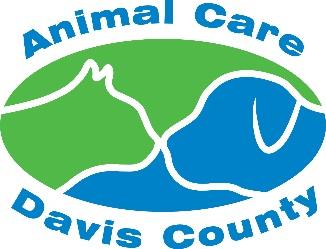 Animal Care of Davis County (Fruit Heights, Utah) logo oval with white outline of cat and dog heads touching noses cat side is colored green and dog side colored blue with blue text above and below