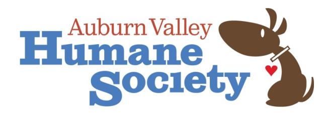 Auburn Valley Humane Society (Auburn, Washington) logo large red and cornflower blue lettering with a drawn sideview of brown dog with white collar red heart for a tag to the right of the lettering