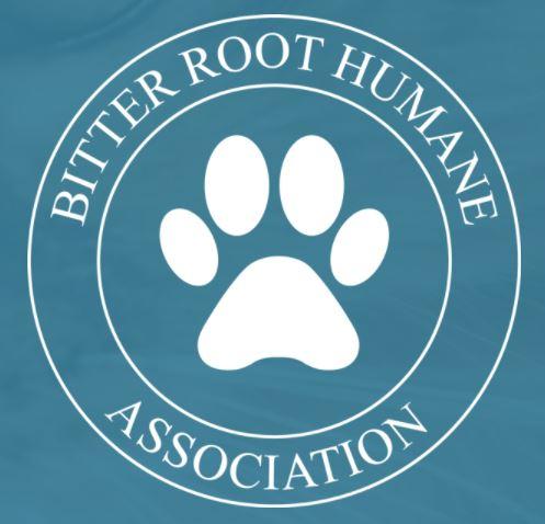 Bitter Root Humane Association, (Hamilton, Montana), logo white paw print in circle with white text and blue background