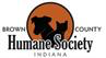Brown County Humane Society (Nashville, Indiana) logo of dog and cat shadows in an orange circle