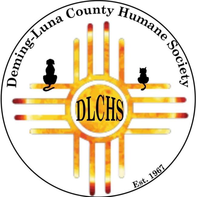Deming-Luna County Humane Society, (Deming, New Mexico), logo black silhouettes of a dog and cat from behind sitting on Native American symbol for the sun in shades of yellow, orange and red with black text in the middle