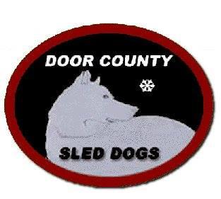 Door County Sled Dogs Inc., (Milwaukee, Wisconsin), logo white husky dog in black oval with red rim and white and black text