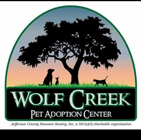 Jefferson County Humane Society, (Monticello, Florida), logo two dogs one cat under tree above white text on green background