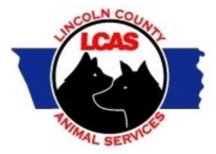 Lincoln County Animal Services, (Lincolnton, North Carolina), logo two black dogs in white circle with red text on top of blue shape of county map