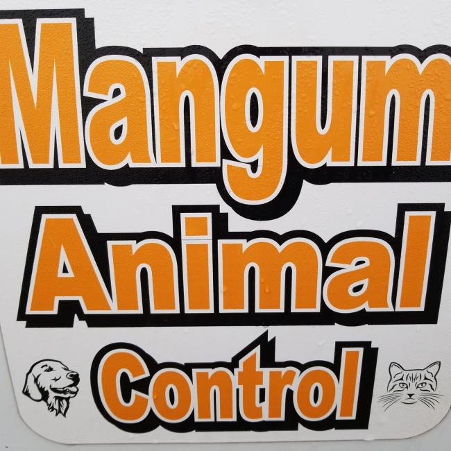 Mangum Animal Shelter (Mangum, Oklahoma) logo photo of sign large orange with black outline letters small drawn dog head on bottom left small drawn cat head on bottom right