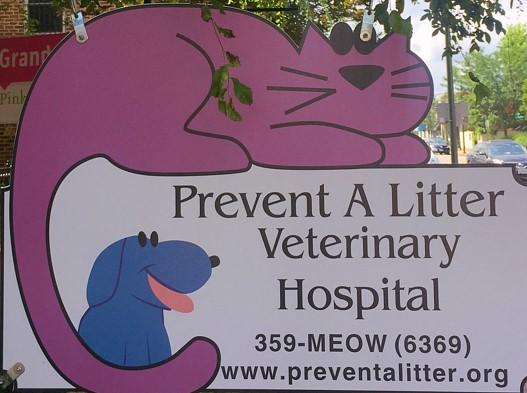 Prevent A Litter Veterinary Hospital (Richmond, Virginia) logo dog and cat on building sign