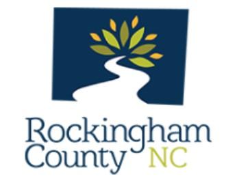 Rockingham County Animal Shelter, (Reidsville, North Carolina), logo white meandering line leading toward green leaves on blue background with blue and green text