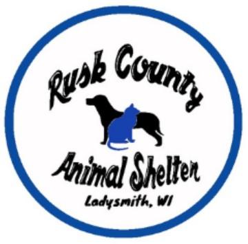 Rusk County Animal Shelter, (Ladysmith, Wisconsin), logo black dog and blue cat in white circle with blue rim and black text