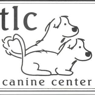TLC Canine Center (Newell, Iowa) logo is a drawing of two dogs with their tails forming a heart