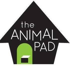 The Animal Pad (La Mesa, California) logo black silhouette of a home white lettering avocado green arched doorway with pet door