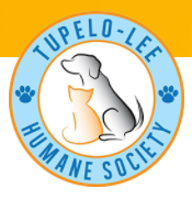 Tupelo Lee Humane Society (Tupelo, Mississippi) logo with gray dog silhouette behind orange cat with org name around in blue