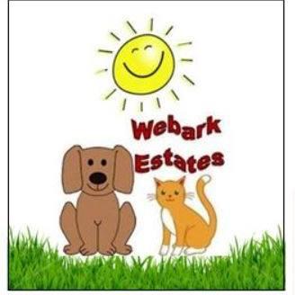 Webark Estates, Inc., (Moundsville, West Virginia), logo drawing of brown dog and red cat on green grass with yellow sun above and red text
