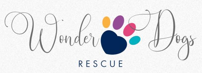 Wonder Dogs, Inc., (Farmersville, Ohio), logo grey text around blue pawprint with yellow purple pink and turquoise toe prints