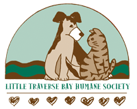 Little Traverse Bay Humane Society (Harbor Springs, Michigan) logo of dog, cat, river, hearts and semicircle 