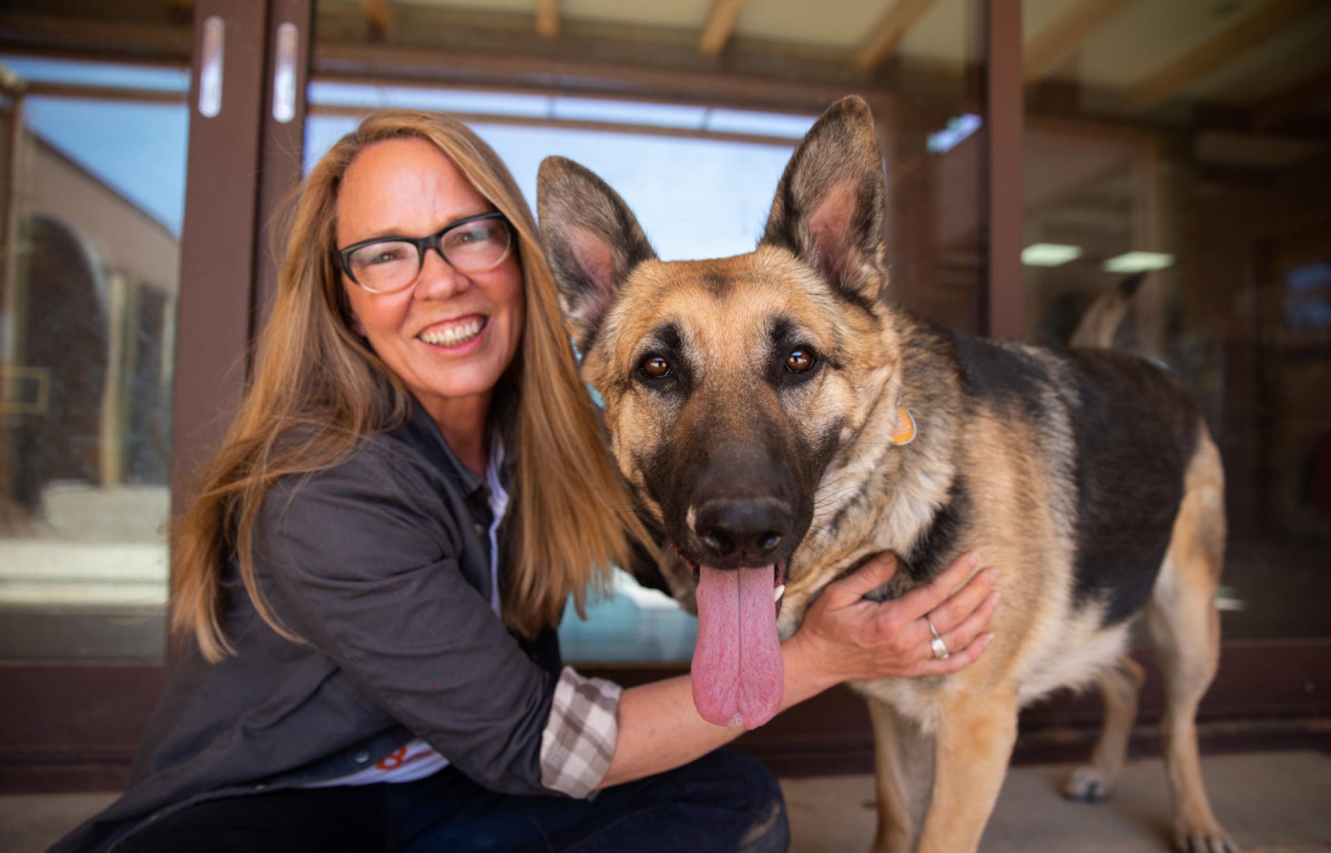 Julie Castle, Best Friends CEO, with Sunny the German shepherd