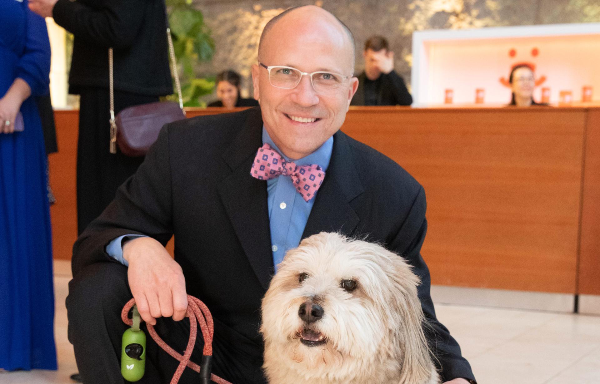 Micarl “Mica” Hill with a dog